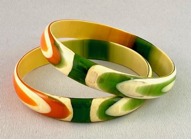 LG37 pr of green, orange & cream 60s lucite bangles